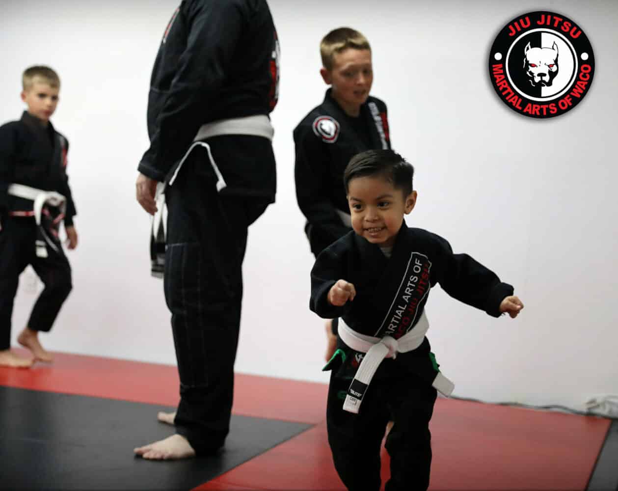 4 year olds warming up in kids class gi bjj