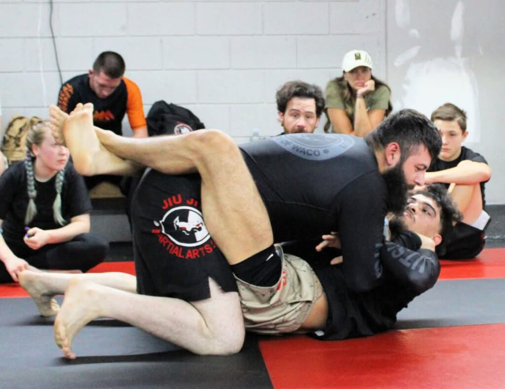 Waco Martial Arts Jiu Jitsu students grappling during class.