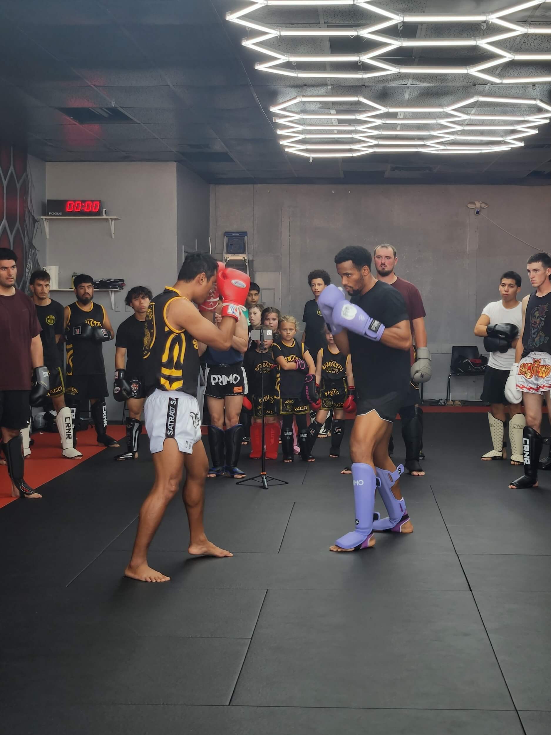 Martial Arts of Waco students wearing sparring gear for match during class.